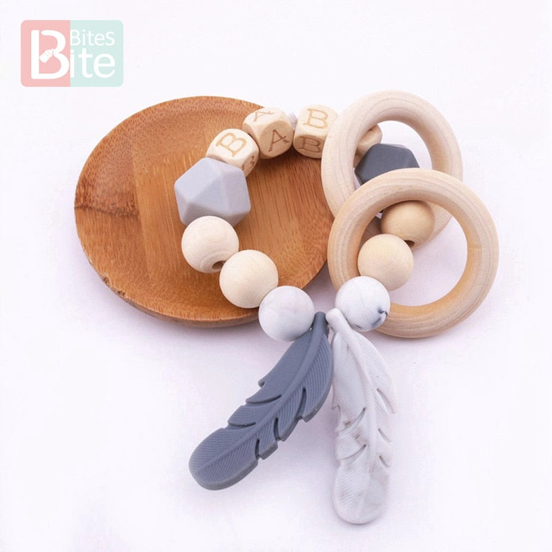 Bite Bites 1PC Food Grade Silicone Feather Teether Chewing Custom Bracelets Baby Care Products Wooden Teething Ring Baby Teether