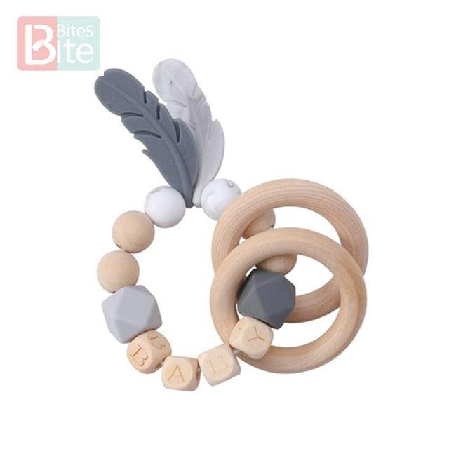 Bite Bites 1PC Food Grade Silicone Feather Teether Chewing Custom Bracelets Baby Care Products Wooden Teething Ring Baby Teether